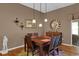 Elegant dining room featuring hardwood floors and a large window at 17716 Se 85Th Ellerbe Ave, The Villages, FL 32162