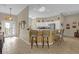 Open kitchen features a breakfast bar with seating and stainless steel appliances at 17716 Se 85Th Ellerbe Ave, The Villages, FL 32162