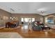 Spacious living room with hardwood floors, and access to backyard patio at 17716 Se 85Th Ellerbe Ave, The Villages, FL 32162