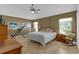 Large main bedroom with ceiling fan and ample natural light at 17716 Se 85Th Ellerbe Ave, The Villages, FL 32162