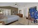 Spacious main bedroom with a walk-in closet and private access to the bathroom at 17716 Se 85Th Ellerbe Ave, The Villages, FL 32162
