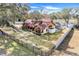 Aerial view of a house with a large backyard and lake access at 18033 Rose St, Groveland, FL 34736