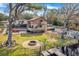 House with pool, deck, and lake access; aerial view at 18033 Rose St, Groveland, FL 34736