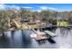 Lakefront property with dock and large house at 18033 Rose St, Groveland, FL 34736