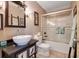 Bathroom with a walk-in shower, toilet and sink at 18033 Rose St, Groveland, FL 34736