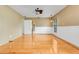 Spacious bedroom features wooden floors, ceiling fan, and wainscoting at 18033 Rose St, Groveland, FL 34736