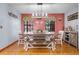 Bright dining room featuring a rustic farmhouse table with bench seating at 18033 Rose St, Groveland, FL 34736