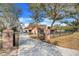 Long driveway leading to a charming house at 18033 Rose St, Groveland, FL 34736