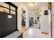 Bright entryway with a bench and coat rack at 18033 Rose St, Groveland, FL 34736