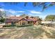 Charming house with landscaping and large windows at 18033 Rose St, Groveland, FL 34736