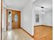 Welcoming foyer with tile flooring, an elegant front door, and adjacent dining room at 18033 Rose St, Groveland, FL 34736