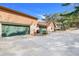 Spacious two-car garage with green doors at 18033 Rose St, Groveland, FL 34736