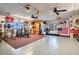 Well-equipped home gym featuring various exercise machines and weights at 18033 Rose St, Groveland, FL 34736