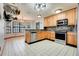 Eat-in kitchen with stainless steel appliances, tile flooring, and lots of natural light at 18033 Rose St, Groveland, FL 34736