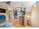 Open kitchen with stainless steel appliances and light wood floors at 18033 Rose St, Groveland, FL 34736