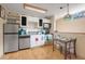 Well-equipped kitchen with stainless steel appliances and white cabinets at 18033 Rose St, Groveland, FL 34736