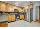 Spacious kitchen with stainless steel appliances and ample cabinetry at 18033 Rose St, Groveland, FL 34736
