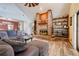 Living room with a cozy fireplace and built-in shelving at 18033 Rose St, Groveland, FL 34736