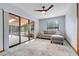 Comfortable living room with sliding doors and neutral decor for relaxation at 18033 Rose St, Groveland, FL 34736