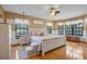 Spacious main bedroom with a large bed and plenty of natural light at 18033 Rose St, Groveland, FL 34736