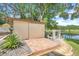 Outdoor storage shed with brick patio and water view at 18033 Rose St, Groveland, FL 34736