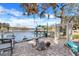 Lakefront patio with seating, fountain, and pergola at 18033 Rose St, Groveland, FL 34736