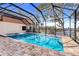 Inviting screened pool and spa overlooking the lake at 18033 Rose St, Groveland, FL 34736