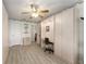 Spacious bedroom with built-in desk, offering a functional and organized space for work or relaxation at 1904 De Hoyos Pl, The Villages, FL 32159