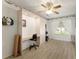 Charming bedroom featuring a built-in desk and shelving, perfect for a home office or study area at 1904 De Hoyos Pl, The Villages, FL 32159