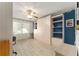 Bright bedroom with built-in shelving and cabinets, offering ample storage space and natural light at 1904 De Hoyos Pl, The Villages, FL 32159