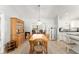 Cozy dining room with wood-look floors and a traditional chandelier at 1904 De Hoyos Pl, The Villages, FL 32159