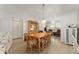 Inviting dining room features a wooden table with seating for six, creating a warm and welcoming atmosphere at 1904 De Hoyos Pl, The Villages, FL 32159