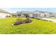 Neatly landscaped front yard with a spacious lawn at 1904 De Hoyos Pl, The Villages, FL 32159