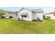 Well-maintained home exterior with landscaping and lawn at 1904 De Hoyos Pl, The Villages, FL 32159