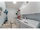 Functional laundry room equipped with modern washer and dryer units, maximizing convenience for household chores at 1904 De Hoyos Pl, The Villages, FL 32159