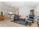 Open-concept living room connects the kitchen, dining area, and seating area, ideal for gatherings at 1904 De Hoyos Pl, The Villages, FL 32159