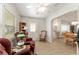 Cozy living room features comfortable seating and plenty of natural light, perfect for relaxation at 1904 De Hoyos Pl, The Villages, FL 32159
