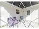 Relaxing screened porch with seating, perfect for enjoying the outdoors at 1904 De Hoyos Pl, The Villages, FL 32159