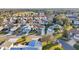Community overview showcasing numerous homes, golf course, and lake at 2486 Five Forks Trl, The Villages, FL 32162