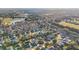 Community overview showcasing numerous homes, golf course, and lake at 2486 Five Forks Trl, The Villages, FL 32162