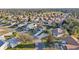 Community overview showcasing numerous homes and lush landscaping at 2486 Five Forks Trl, The Villages, FL 32162