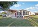 This home features a screened-in porch and a spacious backyard at 2486 Five Forks Trl, The Villages, FL 32162
