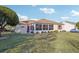 Spacious backyard with a large screened-in porch at 2486 Five Forks Trl, The Villages, FL 32162