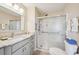 Updated bathroom with granite countertop and walk-in shower at 2486 Five Forks Trl, The Villages, FL 32162