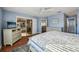 Main bedroom with sliding doors to lanai at 2486 Five Forks Trl, The Villages, FL 32162