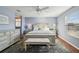 Main bedroom with light blue walls and ceiling fan at 2486 Five Forks Trl, The Villages, FL 32162