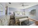 Spacious bedroom with light blue walls and a ceiling fan at 2486 Five Forks Trl, The Villages, FL 32162