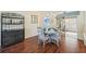 Charming dining area with a round table and hardwood floors at 2486 Five Forks Trl, The Villages, FL 32162
