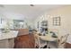 Open concept dining area with hardwood floors and chandelier at 2486 Five Forks Trl, The Villages, FL 32162