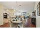 Open dining area with a view to kitchen and living room at 2486 Five Forks Trl, The Villages, FL 32162
